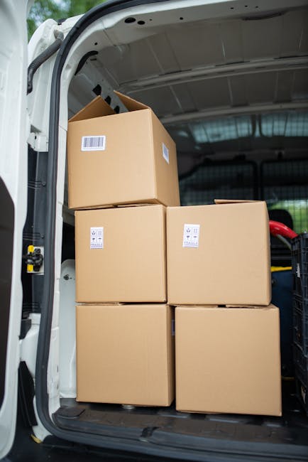 Brown Cardboard Boxes Inside a Delivery Van